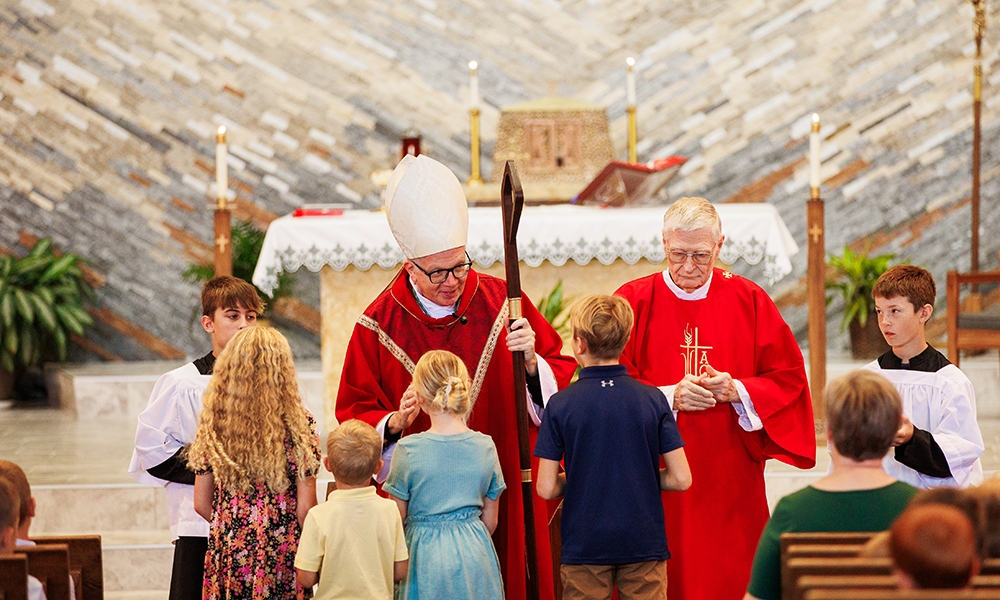 Students gather with Bishop Hying for pastorate-wide Mass